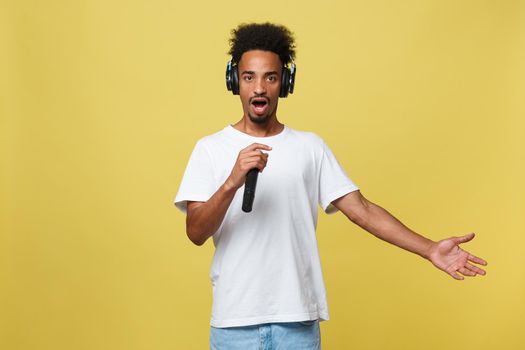 young handsome african american boy singing opera emotional with microphone