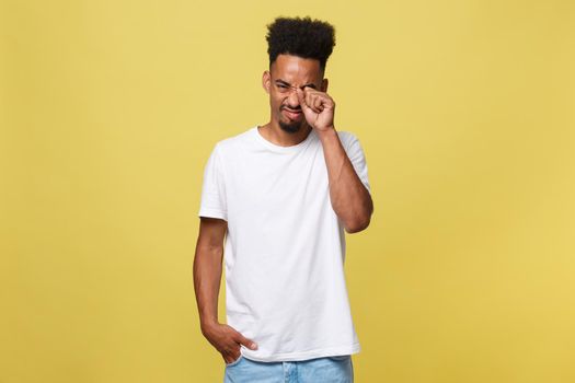 Closeup portrait man with sad expression, isolated on yellow wall background. Human emotions, body language, life perception. Duh moment