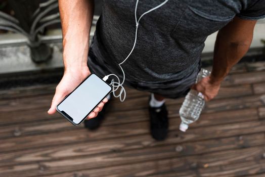 top man holding phone mock up. High resolution photo