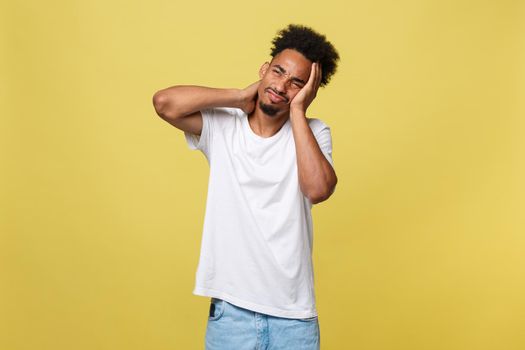 Closeup portrait, really stressed, unhappy young handsome man with really bad neck pain, after long hours of work, studying, isolated white background. Negative human emotions, facial expressions.