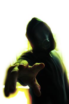 Image of A man in a dark hoodie on a white background reaches towards the viewer