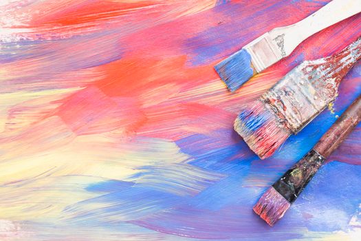 top view colorful brushstroke dirty paint brushes. High resolution photo