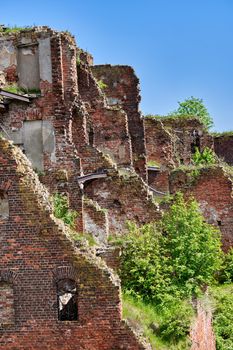 A destroyed brick building on the territory of the Oreshek fortress, red brick ruins