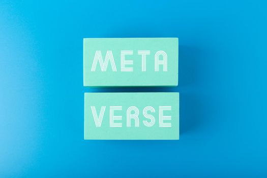 Metaverse modern minimal concept in blue colors. Written metaverse single word on aqua blue rectangles against blue background. Future technologies. 