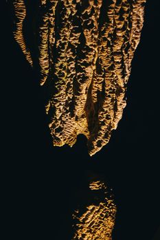 Image of High contrast detail of rock formations in cave stalagmites and stalactites