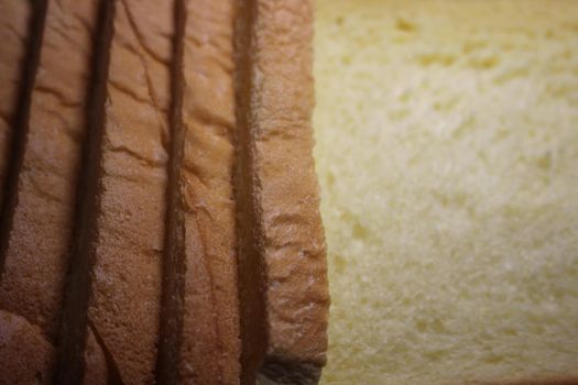 Closeup top view of freshly prepared slices of toast bread. Food background for bakery products