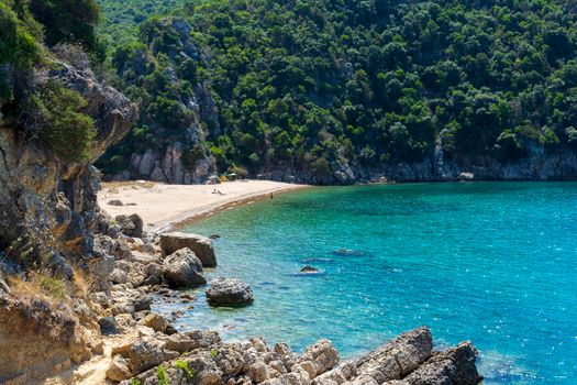 Quiet, hot sandy beach, known as Kantouni Messinia, Greece. A small hidden beach in Greece.