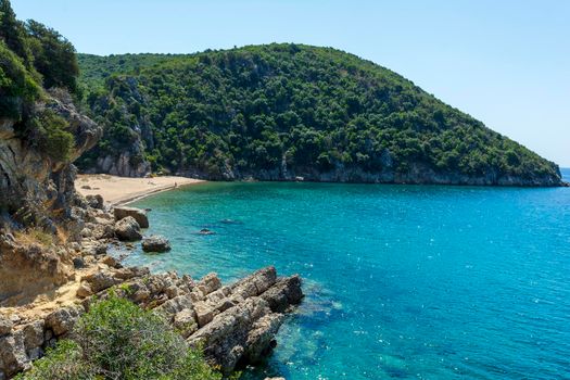 Quiet, hot sandy beach, known as Kantouni Messinia, Greece. A small hidden beach in Greece.