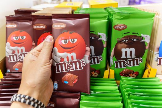 Volzhsky, Russia-September 21, 2021: Milk chocolate m and ms made by Mars Inc. Selective focus