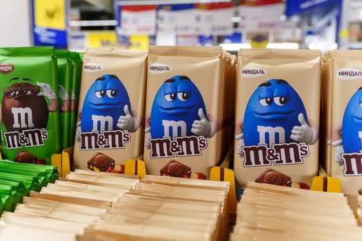 Volzhsky, Russia-September 21, 2021: Milk chocolate m and ms made by Mars Inc. Selective focus