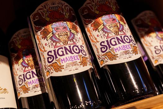 Volzhsky, Russia-September 21, 2021: Signos Malbec is an Argentine wine that is part of the Signos line created by the manufacturer Bodegas Callia specifically for the younger generation. Selective focus