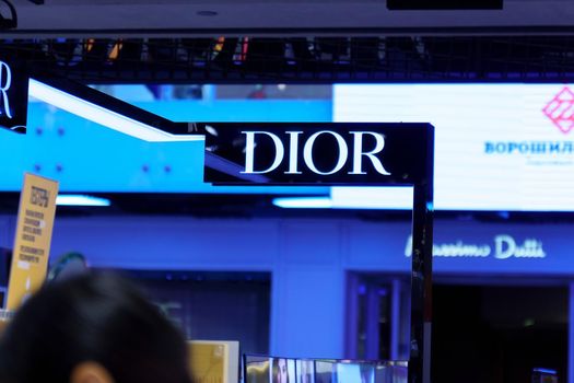 Volgograd, Russia-September 16, 2021: Dior store logo in shopping centre. Dior is a French company founded by designer Christian Dior.