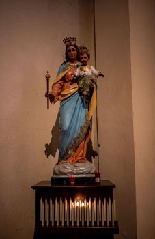 statue of the madonna with jesus in the church