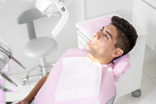 Young Patient in modern dental clinic. High quality photo