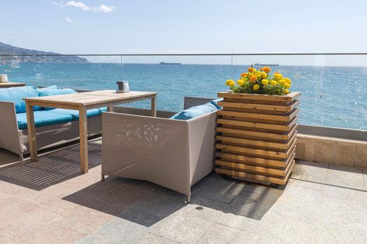 cafe tables on the embankment with a sea view. High quality photo