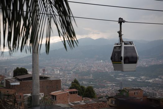 Cable car in transit in Medellin, Colombia with mountains in the background