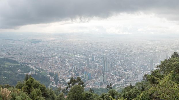 View from the top of Mount Monserrate in Bogota, Colombia. Storm clouds and skyline.