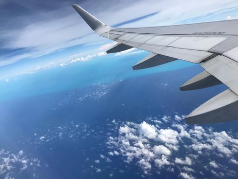 View from airplane window looking down at tropical waters in Bogota, Colombia.