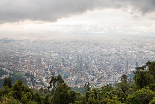 View from the top of Mount Monserrate in Bogota, Colombia. Storm clouds and skyline.