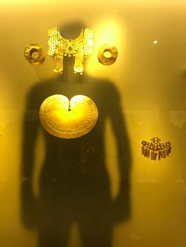 Shadow of person with gold lungs at Museu do Ouro in Bogota, Colombia.