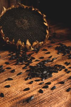 Dried sunflower and roasted seeds on the old wooden table