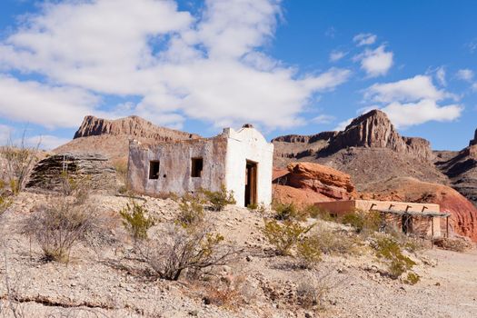 Deserted rancheria adobe buildings in colorful hot rocky desert of south western Texas, USA