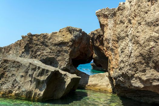 Rocky beach closeup in the seaside Messenian area during the summer period. Messenia, Peloponnese, Greece.