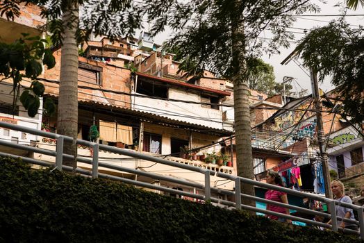 View of Medellin, Colombia homes on hillside. Close up with big trees