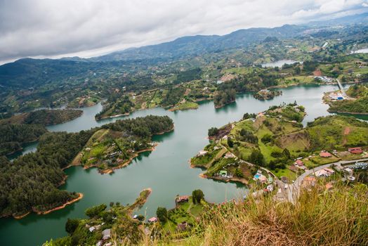 View at the top of El Penon de Guatape looking out at a beautiful view of the lagoon.