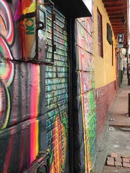 Graffiti wall art at hostel in Bogota, Colombia vibrant neon colors