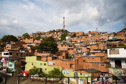 Neighborhood in Medellin, Colombia with view of homes on hillside.