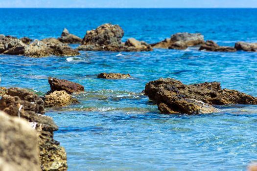 Rocky beach closeup in the seaside Messenian area during the summer period. Messenia, Peloponnese, Greece.