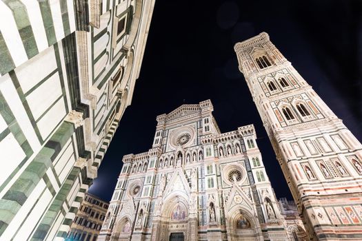 Florence, Italy - Circa August 2021: Florence by night. The  illuminated architecture of the famous cathedral exterior.