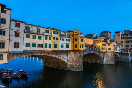 Florence, Italy - Circa June 2021: sunset on Ponte Vecchio - Old Bridge. Amazing blue light before the evening.