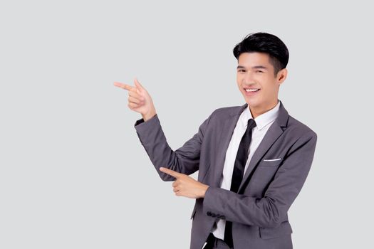 Portrait young asian business man pointing and presenting isolated on white background, advertising and marketing, executive and manager, male confident showing success, expression and emotion.