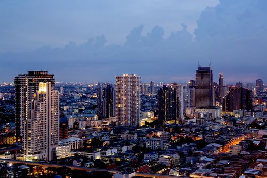 Bangkok THAILAND - July 11 2020 : View landscape of Bangkok tower with river in the evening, downtown and  cityscape in twilight at Thailand, skyscraper and condominium.