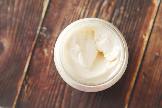 close up of Mayonnaise in container on table