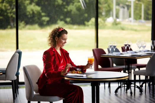 Cropped view of woman eating salad for lunch in luxury restaurant, Healthy lifestyle, diet concept