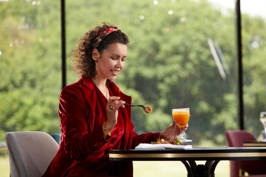 Cropped view of woman eating salad for lunch in luxury restaurant, Healthy lifestyle, diet concept