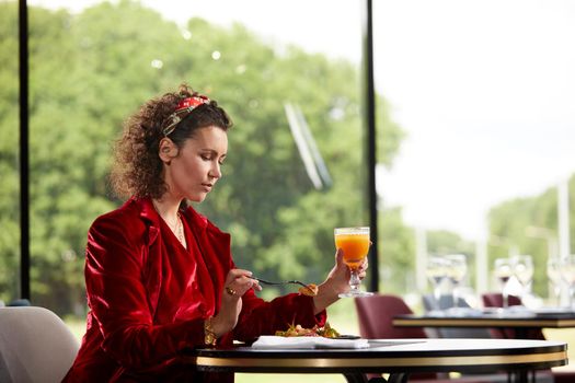 Cropped view of woman eating salad for lunch in luxury restaurant, Healthy lifestyle, diet concept