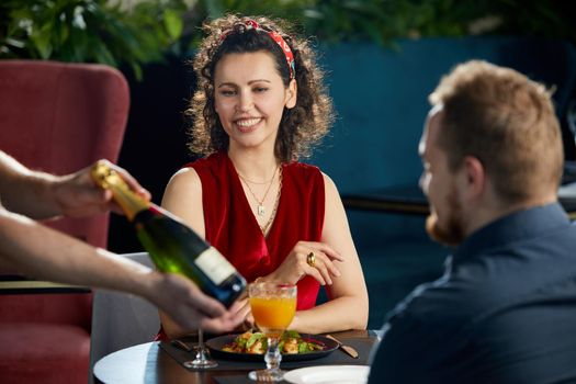 young couple having dinner in a fancy restaurant