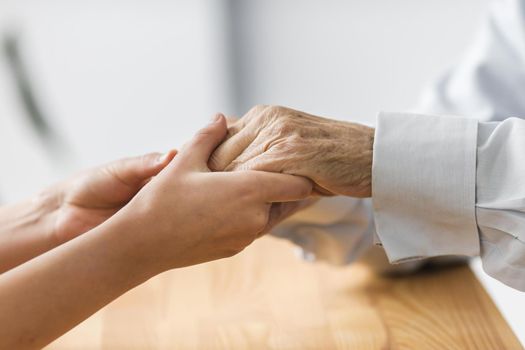 nurse holding senior man s hands comfort. Resolution and high quality beautiful photo