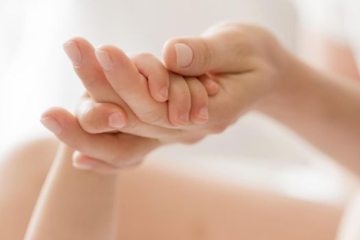 close up mom holding baby s hand. Resolution and high quality beautiful photo