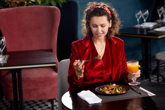 Cropped view of woman eating salad for lunch in luxury restaurant, Healthy lifestyle, diet concept