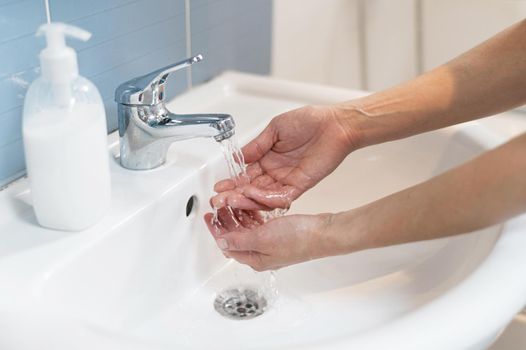 person washing hands with soap 2. Resolution and high quality beautiful photo