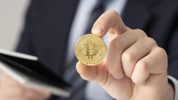 businessman holding bitcoin close up. Resolution and high quality beautiful photo