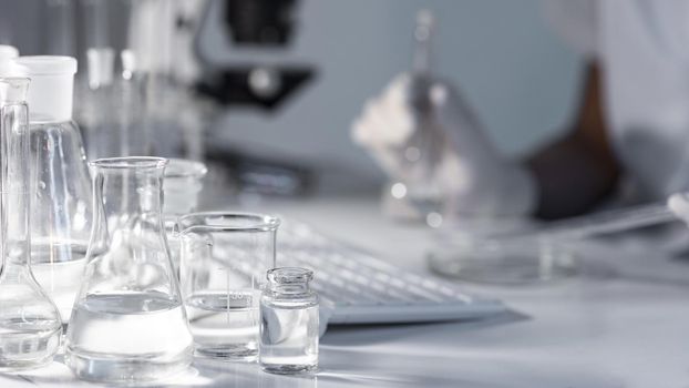 close up blurry researcher holding glassware. Resolution and high quality beautiful photo