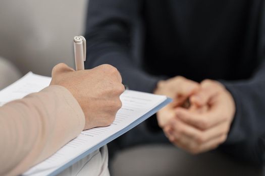 mid shot woman therapist taking notes clipboard. Resolution and high quality beautiful photo