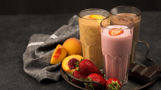 assortment milkshake glasses with fruits chocolate. Resolution and high quality beautiful photo