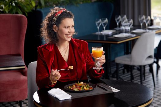 Cropped view of woman eating salad for lunch in luxury restaurant, Healthy lifestyle, diet concept